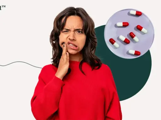 Kvinna med tandvärk håller handen mot kinden, bredvid en skål med kapslar som kan symbolisera tandinfektion och antibiotika.